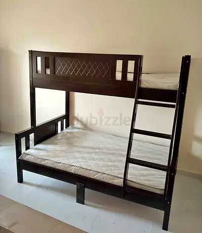 Dark wood bunk bed with ladder, double bottom & single top - good condition
