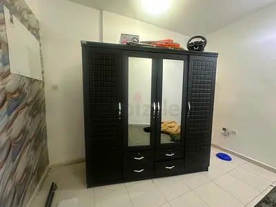 Dark Wood 4-Door Wardrobe with Mirror and Drawers - Good Condition