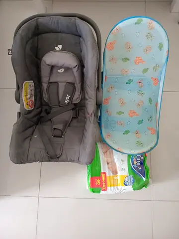 Joie infant car seat (rear-facing) with baby bath tub and pamper packet