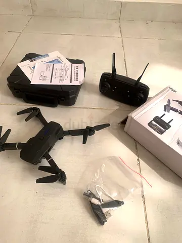 Compact foldable camera drone with controller and case