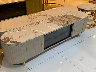 Modern oval marble-top TV cabinet with storage and fireplace