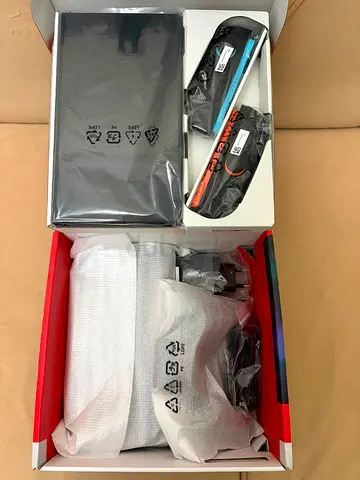 Nintendo Switch console with Neon Joy-Con (boxed, unused accessories)