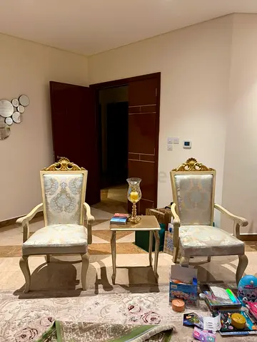 Pair of classic carved armchairs with side table - elegant living room set