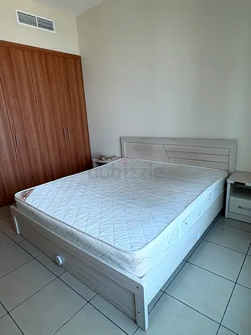 Queen size bed frame with mattress and two bedside tables - light wood