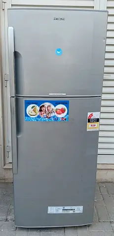 this Hitachi double door Refrigerator, condition perfect working, silver color, 365 liters capacity.