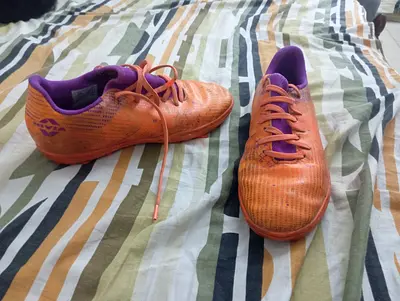 Used orange football/soccer boots, size approx. 40 - good for all play Nivia rabona