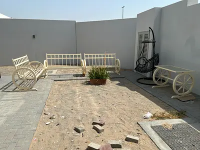 Outdoor white metal garden seating set with swing and side table