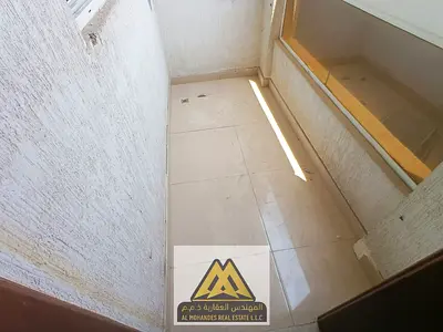 A spacious one-bedroom apartment with a balcony in Al Rawda 3 area, close to all services and Moham