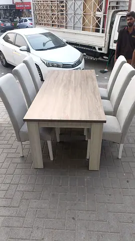 6-seater wood finish dining table with upholstered chairs
