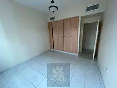 Two bedroom apartment with living room for annual rent in Abu Shagara prime location near services A