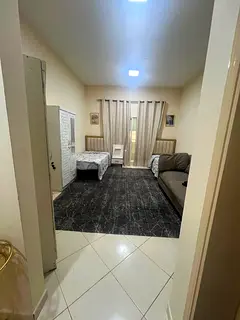 One-bedroom apartment with a living room, located directly off the Dubai exit.