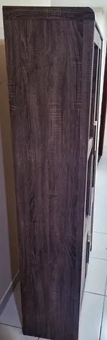 Tall narrow storage cabinet / bookshelf in dark wood finish - good condition