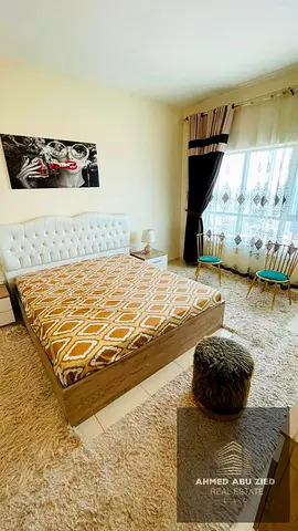 Largest furnished one-bedroom apartment with brand new furniture for rent in Orient Towers. Features include a closed kitchen, balcony with sea view,