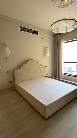 BRAND NEW upholstered bed frame with headboard, king size. Beige velvet