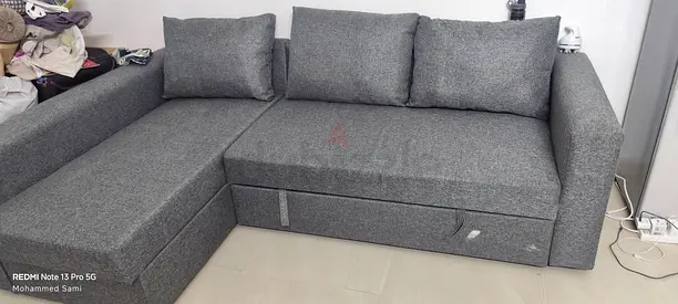 Grey fabric storage ottoman with lift-up seat