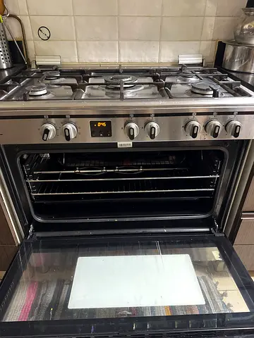 Stainless Steel Gas Range with Convection Oven - Good Working Condition