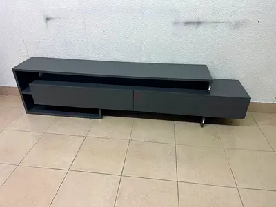 Modern low-profile TV unit / media console in dark gray