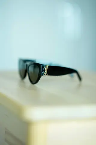 Black Designer-Style Sunglasses with Gold Logo Accent Saint Laurent
