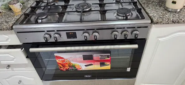 Stainless Steel 5-Burner Gas Range with Built-in Oven - Good Condition