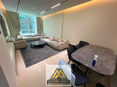 A spacious 1-bedroom apartment with a living room is available for cash sale in Orient Towers, Ajman.