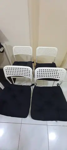 Set of 4 IKEA White Plastic Chairs with Black Cushions - Good Condition