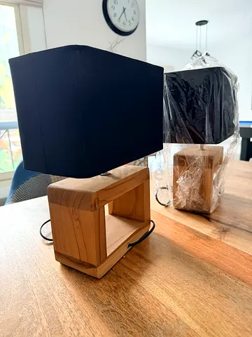 Pair of Balinese wooden bedside table lamps with black shades