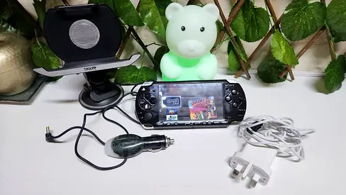 PSP Slim with 128GB card + charger and accessories
