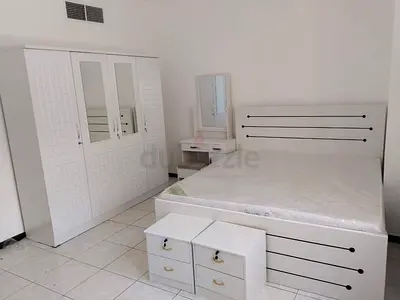 White bedroom set: wardrobe, bed with mattress, bedside tables