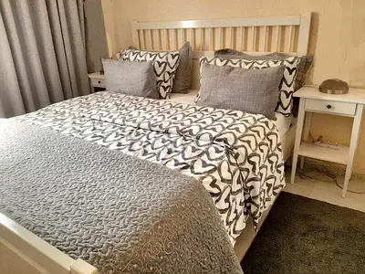 Wooden King Bed set white color.
