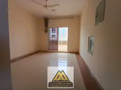 A spacious studio apartment with a balcony and separate kitchen in Al Rawda 3, close to all services