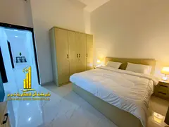 For monthly rent in Ajman, two-bedroom apartment with a balcony open view, fully furnished with eleg