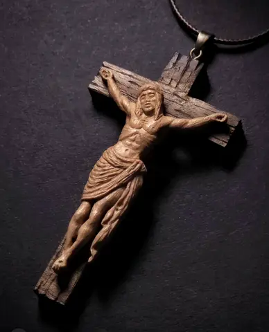 Hand-carved wooden crucifix pendant on cord necklace