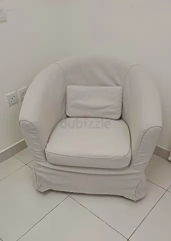 Beige upholstered single armchair with removable cover
