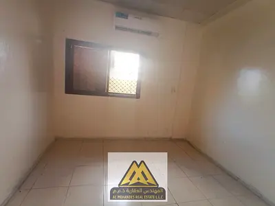 Two bedrooms, living room, one bathroom, split AC, maintenance included (owner's responsibility), close to all services, near Sharjah and Dubai exit.