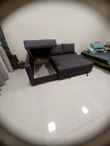 Compact 2-seater grey fabric sofa with ottoman — good condition
