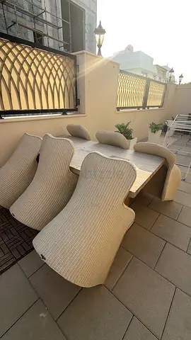 Outdoor wicker patio dining set with 6 chairs and cushions and table
