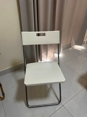 White folding chair with metal frame - good condition