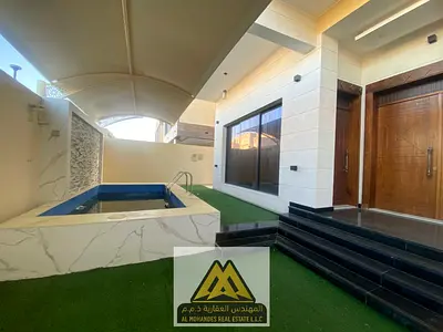 A spacious villa with 5 master bedrooms and a swimming pool in the Al Yasmin area, behind the park,