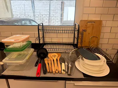 Kitchen utensils set with dish rack, containers and plates - used