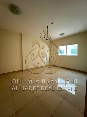 غرفتين وصالة للإيجار على قناة القصباء | تشطيب حديث | صيانة وموقف مجاني | 50,000 درهم