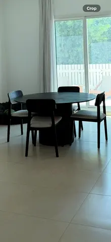 Wooden Dining table set with 4 chairs — modern black round table. Brought over from New Zealand.