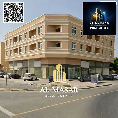 Building for sale (Al Rawda 3) – mixed-use (residential/commercial), corner plot (two streets), fre