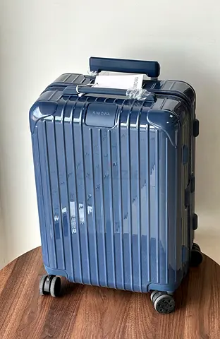 Rimowa glossy blue hardshell suitcase