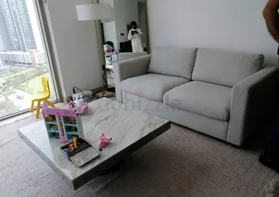 Comfortable light grey 2-seater sofa bed