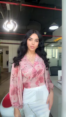 Pink floral wrap blouse — like new, size unspecified
