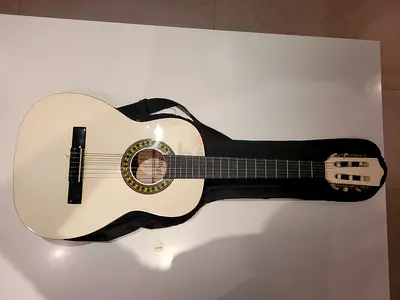 White classical guitar with soft case - good condition
