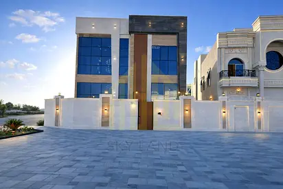 New corner villa with a full stone facade and central air conditioning in a prestigious residential