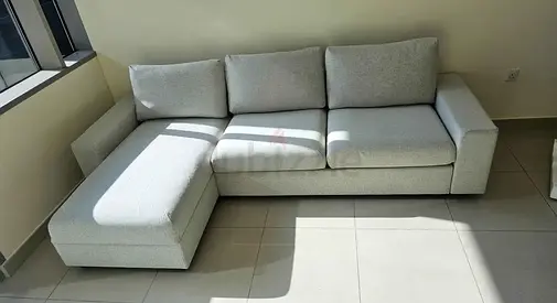 Light grey L-shaped 3-seater sofa bed with chaise lounge - good condition