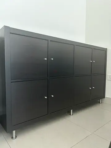 Dark wood 4-door cabinet with metal legs - good condition