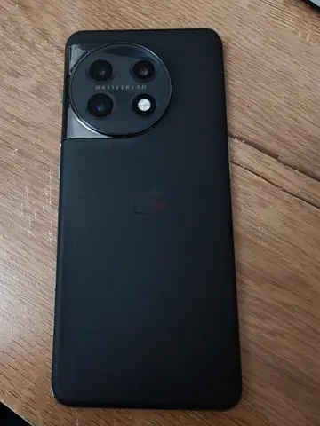 OnePlus 11 smartphone with triple rear camera - good working condition minor glass broken